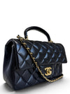 Bolso "Lambskin Quilted Mini Top Handle Rectangular Flap"