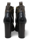 Botas "Patent Calfskin Monogram Star Trail Ankle Boots"