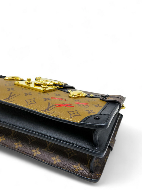Bolso "Trunk Clutch Monogram Reverse"
