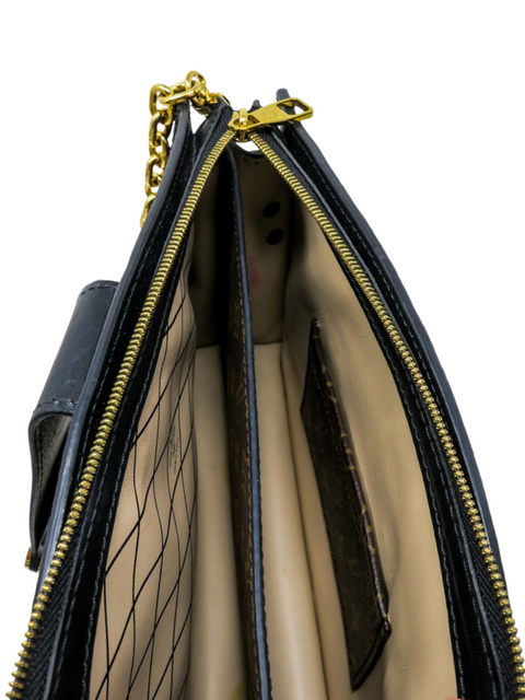 Bolso "Trunk Clutch Monogram Reverse"