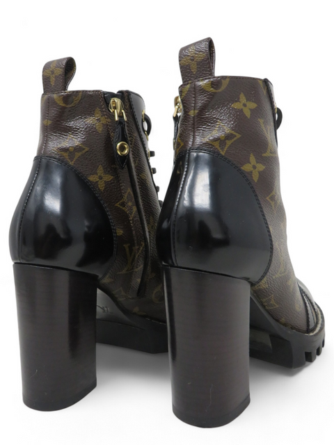 Botas "Patent Calfskin Monogram Star Trail Ankle Boots"