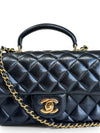 Bolso "Lambskin Quilted Mini Top Handle Rectangular Flap"