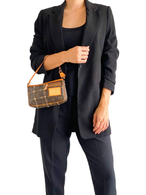 Bolso "Monogram Riveting Pochette Accessories"