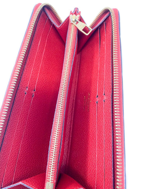 Billetera "Monogram Empreinte Zippy"