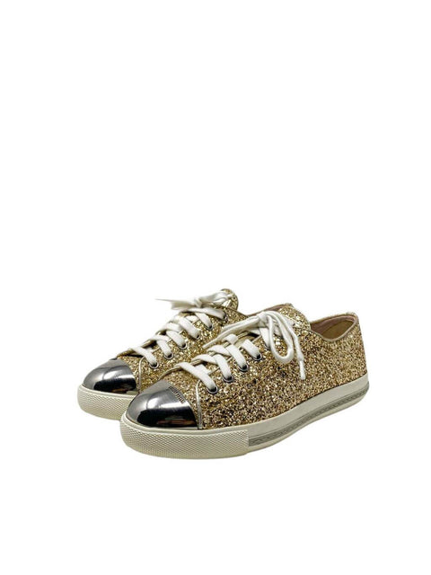 Tenis Dorados