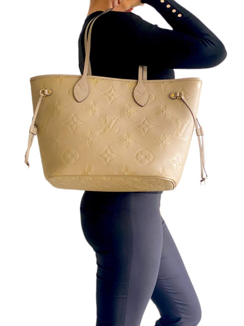 Bolso "Monogram Giant Empreinte Neverfull MM"